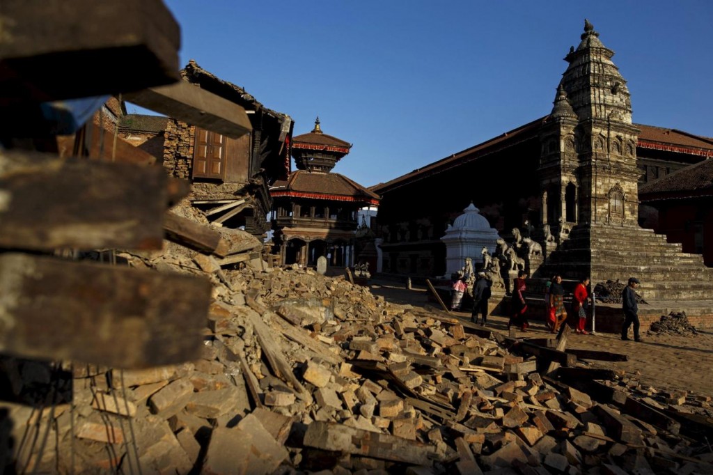 Local residents walk past the rubble from last week's earthquake in Bhaktapur, Nepal, May 4, 2015. REUTERS/Athit Perawongmetha