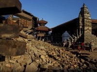 Local residents walk past the rubble from last week's earthquake in Bhaktapur, Nepal, May 4, 2015. REUTERS/Athit Perawongmetha