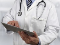 Doctor using digital tablet