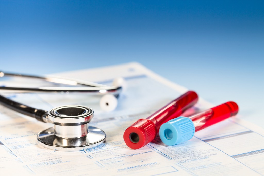 Stethoscope tube of blood and medical check list