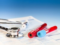 Stethoscope tube of blood and medical check list