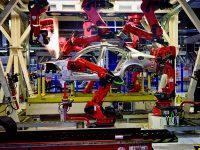 CASSINO, ITALY - NOVEMBER 24: A robot moves in the Body Shop where they assemble the Alfa Romeo Giulia and Stelvio in the Cassino Assembly Plant FCA Group. This is the most highly-automated area of the plant with nearly 1300 robots installed on  November 24, 2016 in Cassino, Italy.