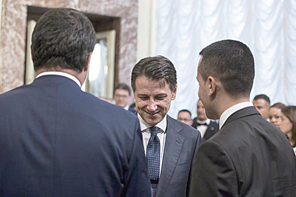 Italian Prime Minister Giuseppe Conte (C) with his vice Prime Ministers Luigi Di Maio (R) and Matteo Salvini (L), prior receiving from the outgoing Prime Minister Paolo Gentiloni the small silver bell to open the First Council of Minister at Chigi Palace in Rome, 1 Jun 2018. ANSA/ANGELO CARCONI