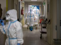 A member of medical staff wearing a personal protective equipment (PPE) walks in the Intensive Care Unit (ICU) for the novel coronavirus, COVID-19 cases, in the San Filippo Neri hospital in Rome, on October 30, 2020. - Italy's Prime Minister Giuseppe Conte tightened nationwide coronavirus restrictions after the country registered a record number of new cases, despite opposition from regional heads and street protests over curfews. ANSA/MASSIMO PERCOSSI