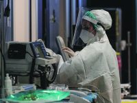 Health workers wearing overalls and protective masks in the intensive care unit of the GVM ICC hospital of Casalpalocco near Rome during the second wave of the Covid-19 Coronavirus pandemic, Italy, 18 November 2020. ANSA/GIUSEPPE LAMI